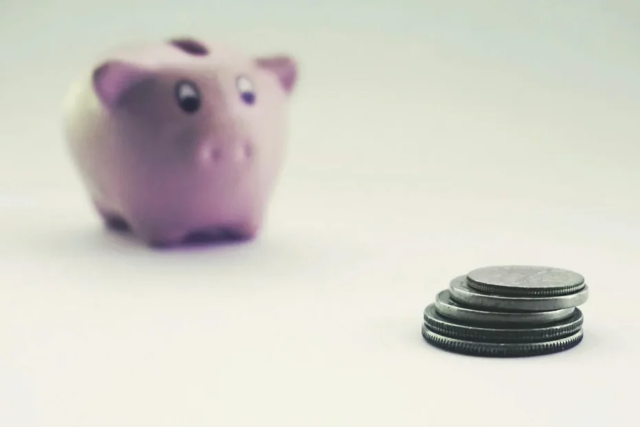 piggy bank with growing stack of coins