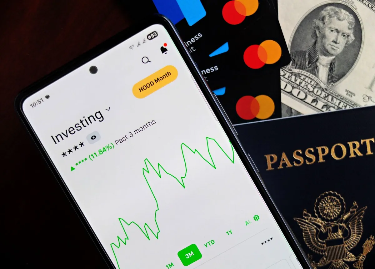 investing app on phone with chart